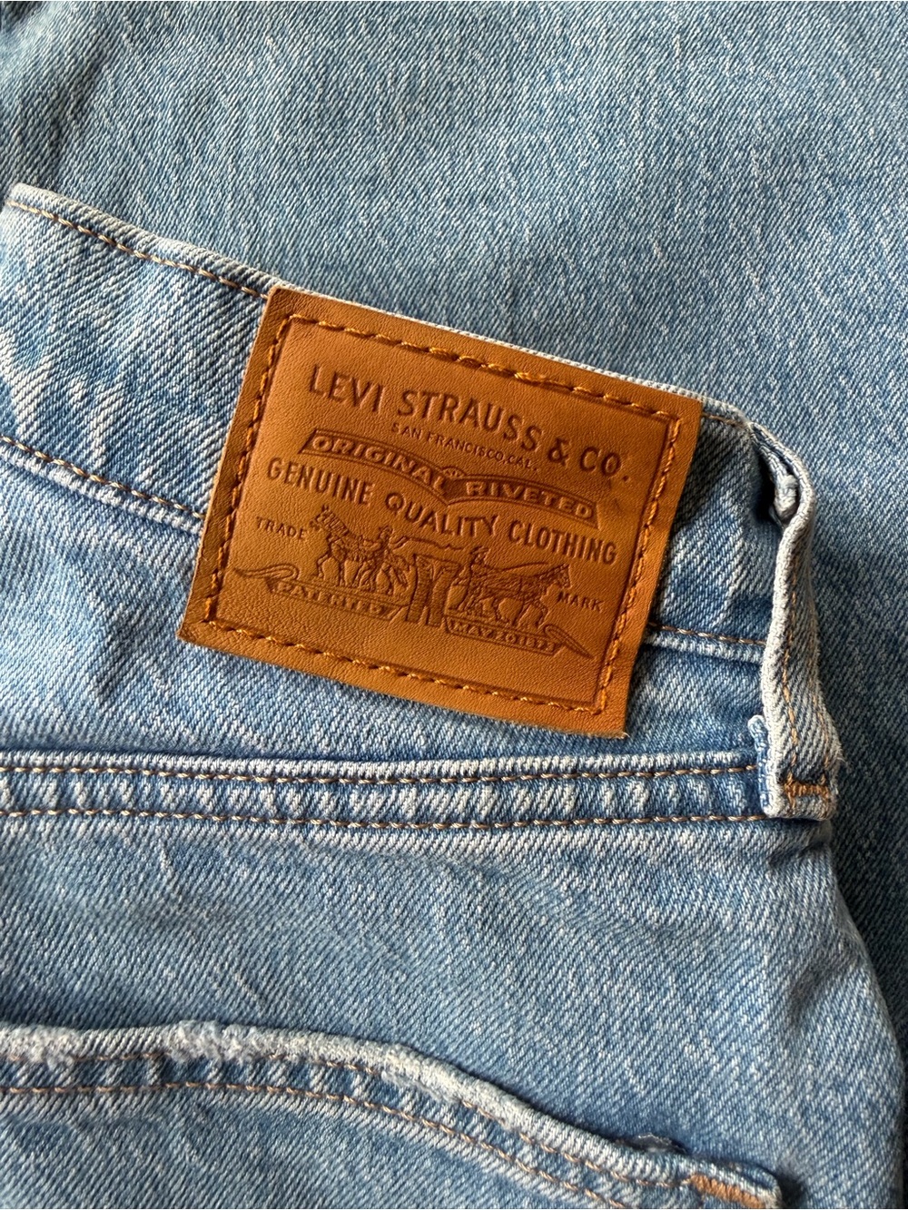 Levi's High-Rise Light Blue Denim Jeans with Tan Leather Patch